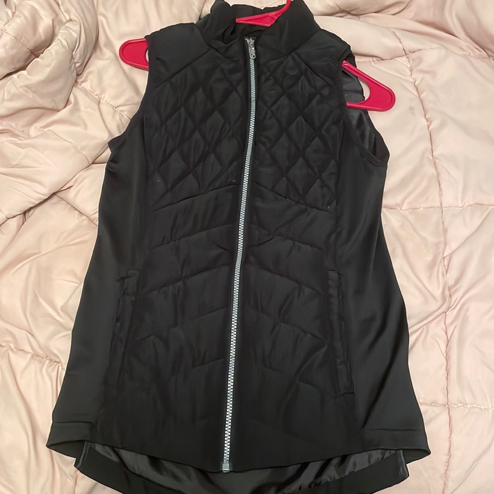 It’s a cute vest to wear over a long sleeve.